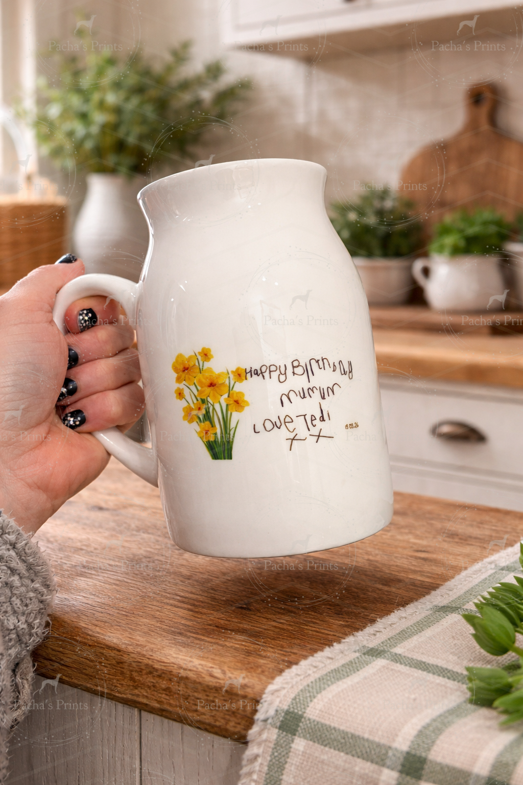 Handwritten ceramic mini vase with daffodil design on rustic wooden table