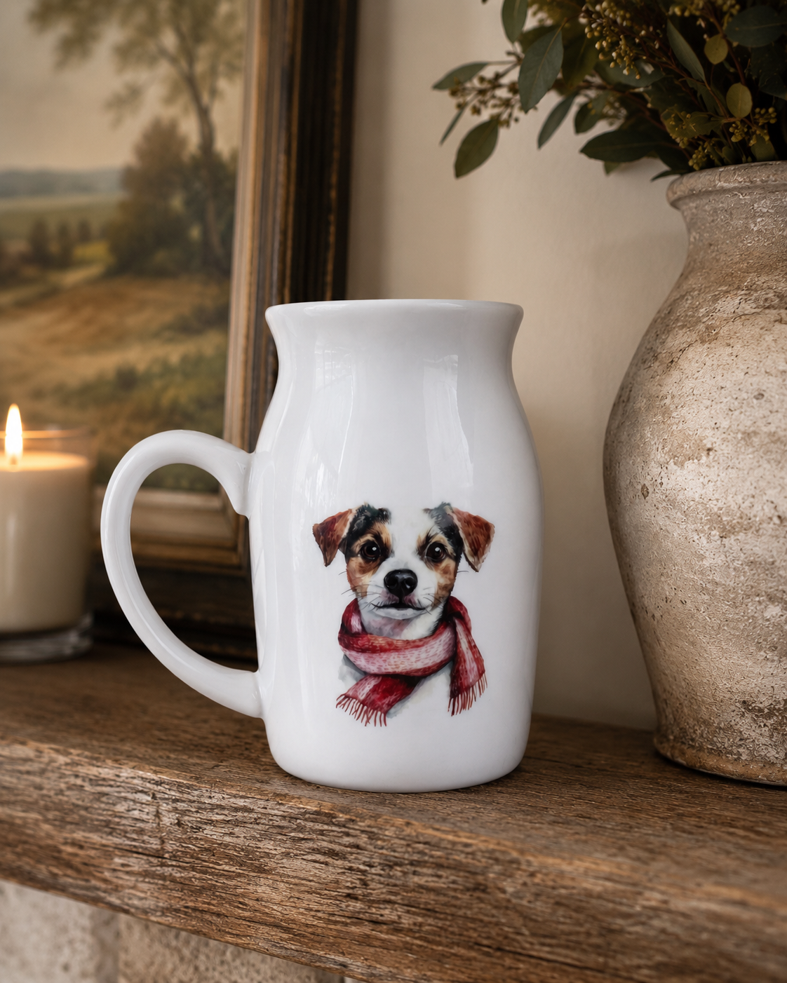 White mug with a dog illustration wearing a red scarf on a wooden surface.