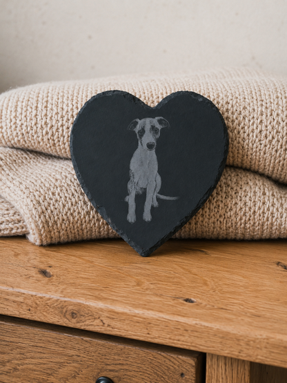 Heart-shaped slate with a dog illustration on a stack of beige towels