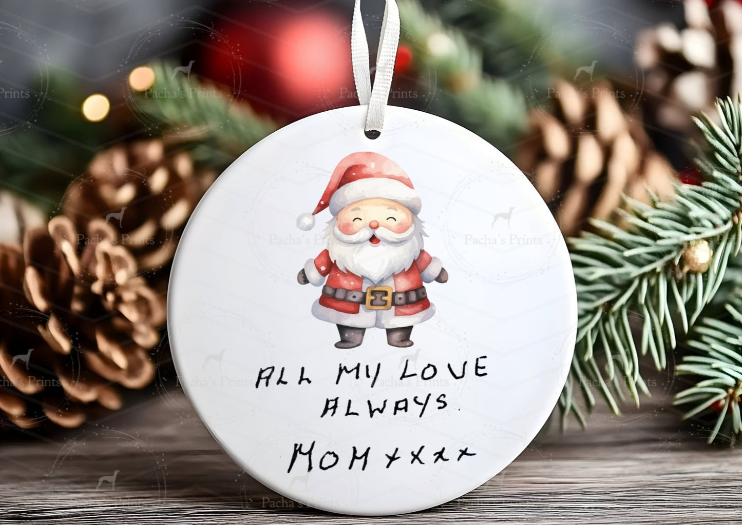 Christmas ornament with Santa Claus and text 'All my love always. Mommy' against a festive background.